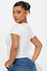 Jesus Saves I Spend Baby Tee - White